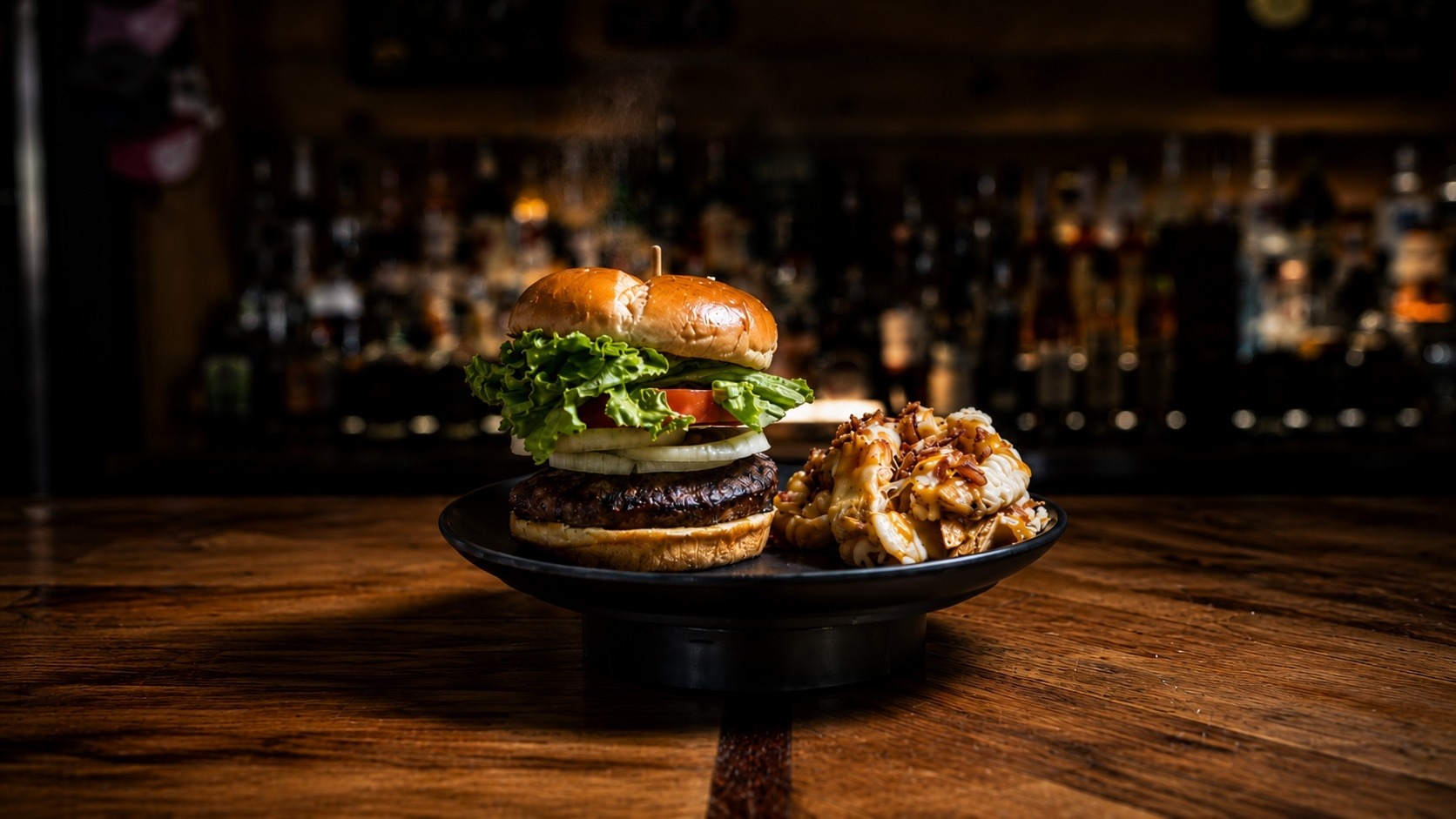 Burger and fries on the bar at Buffalo Trail Restaurant